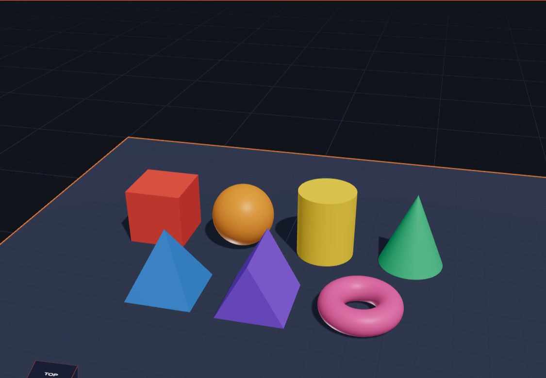 A cube, a ball, a cylinder, a cone, a pyramid, a triangular prism and a donut on the plate