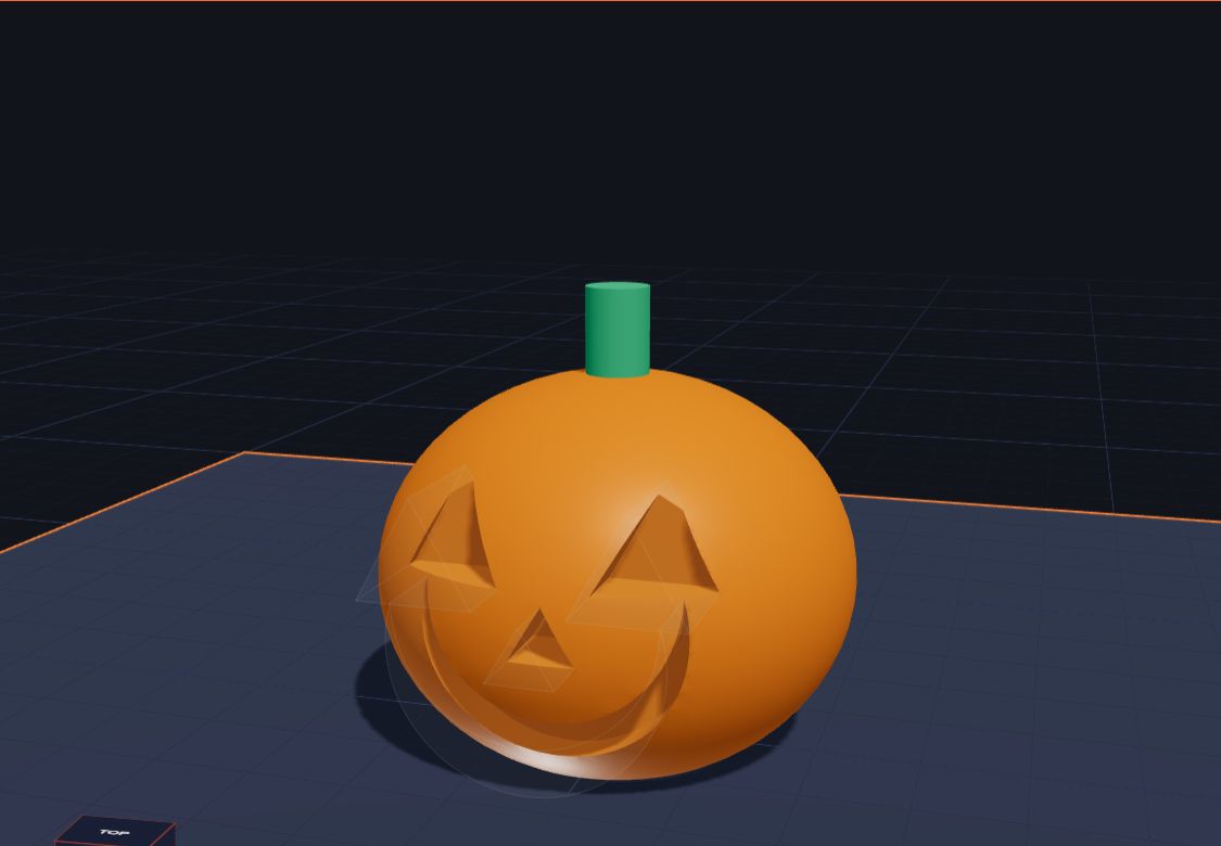 An orange 3D pumpkin with triangle eyes, a triangle nose and a big smile